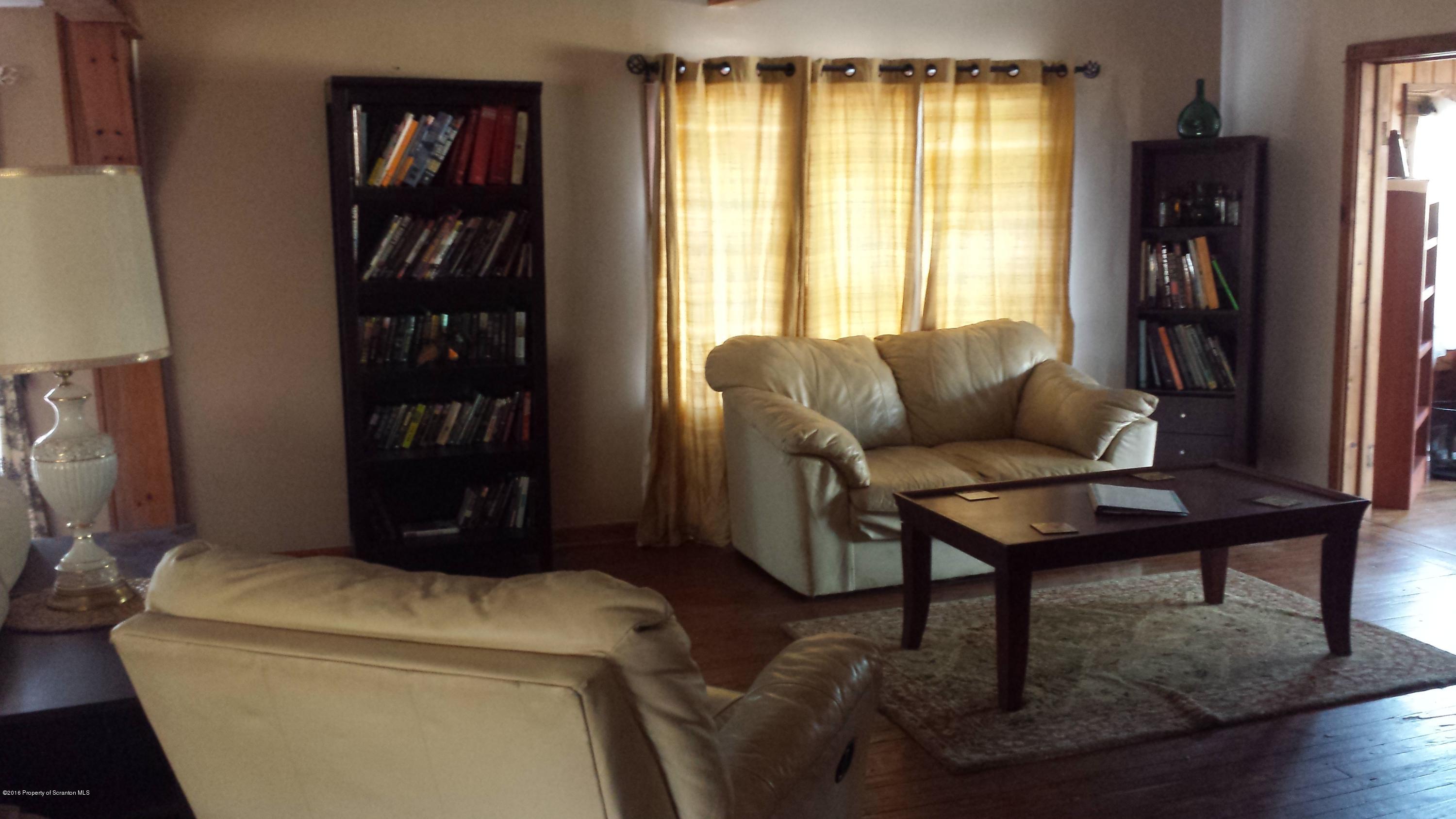 6591 Lindaville Road Kingsley, PA 18826 - Photo 7 of 28 a living room with furniture and a window