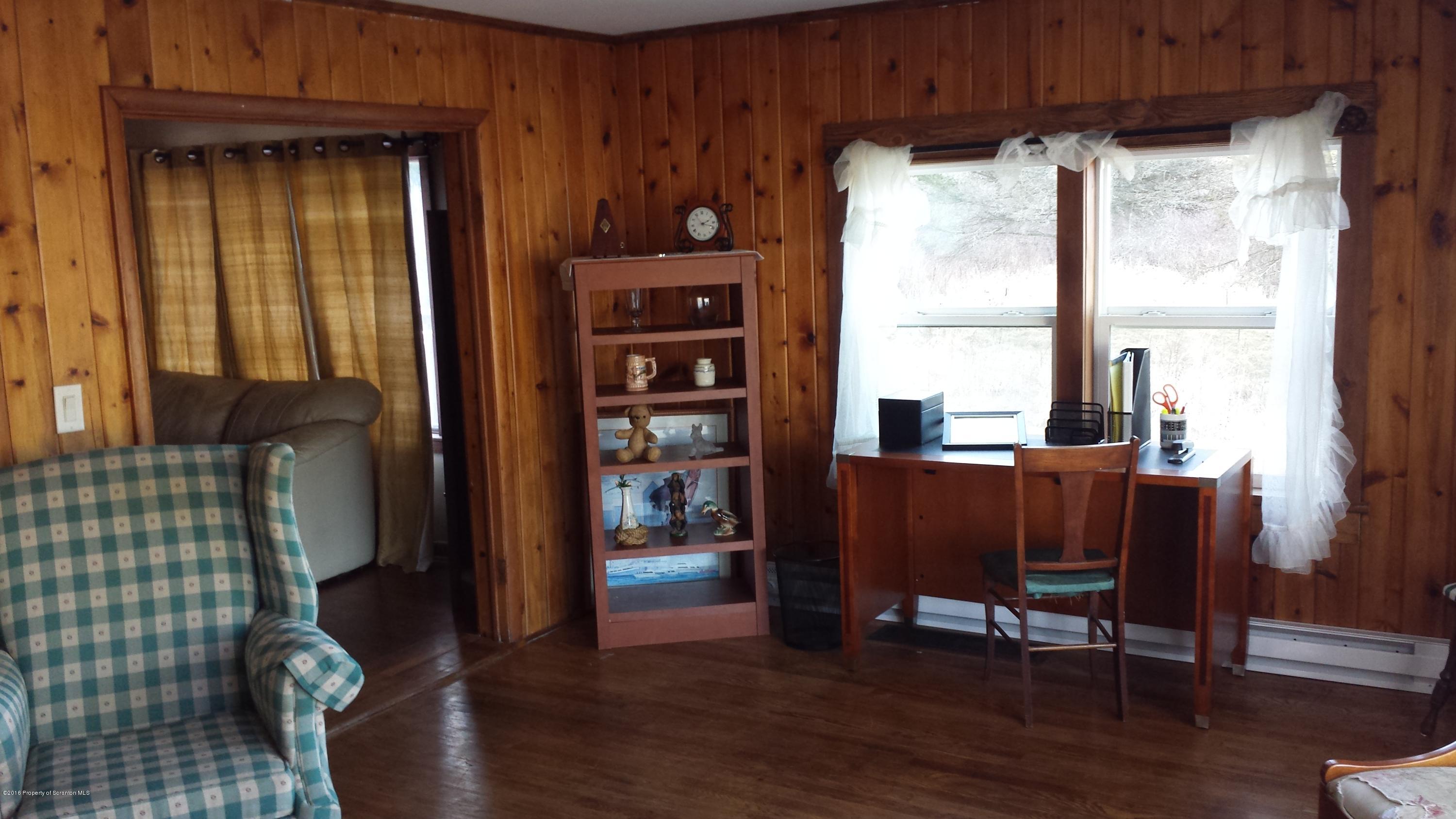 6591 Lindaville Road Kingsley, PA 18826 - Photo 8 of 28 a view of a livingroom with furniture and windows