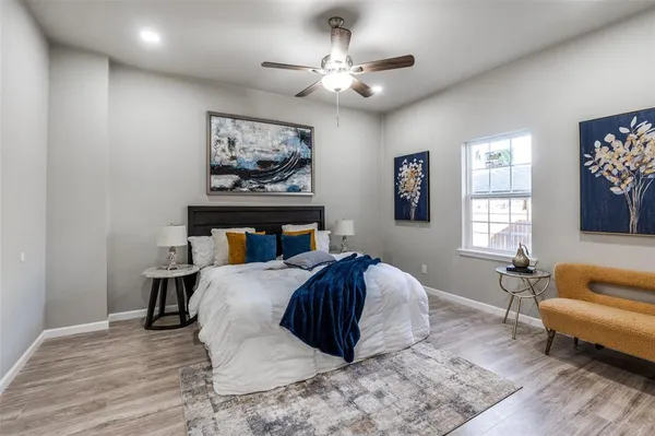 a spacious bedroom with a bed and a couch