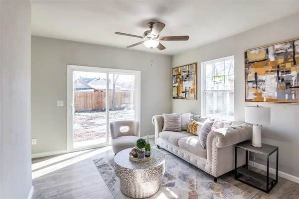 a living room with furniture and a large window