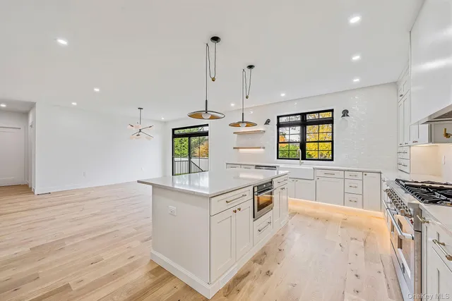 a large kitchen with stainless steel appliances