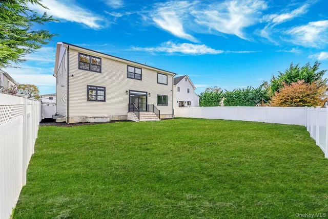 a bedroom with a bed and a night stand under it