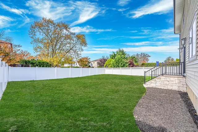 a view of yard with swimming pool