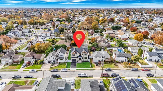 a view of a backyard with wooden fence