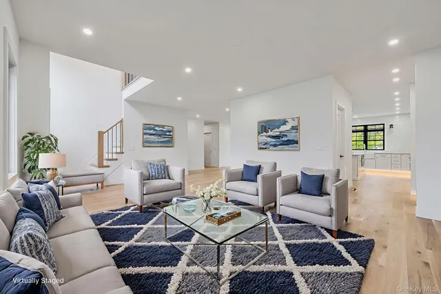 a living room with furniture and a rug