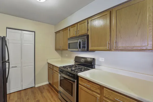 a kitchen with a stove and a microwave