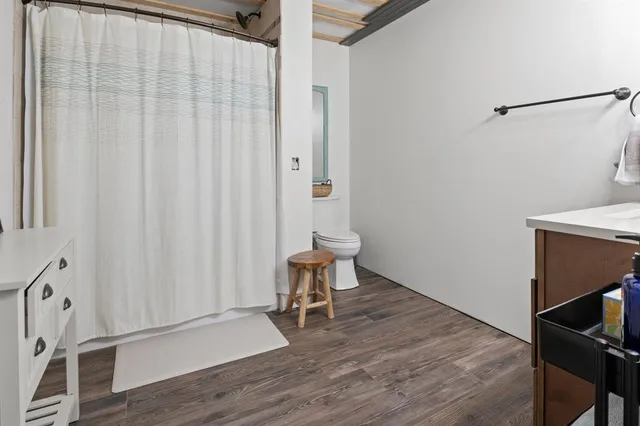 a room with a chair and wooden floor