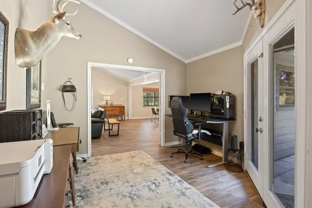 a view of a livingroom with couch and a workspace