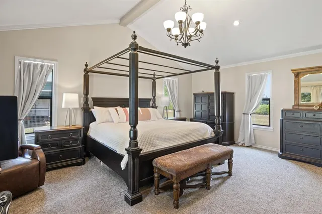 a bedroom with a bed dresser and a window