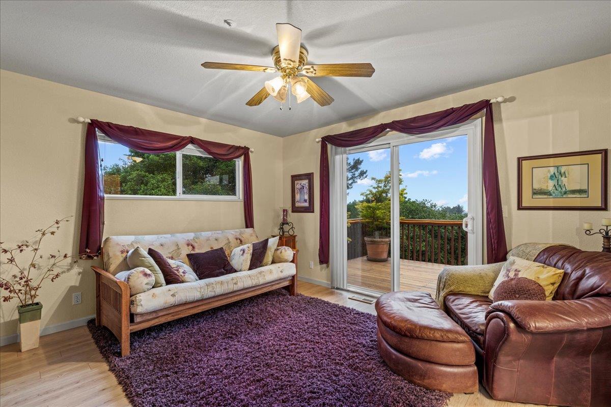 6980 Timeview Way Prunedale, CA 93907 - Photo 18 of 47 a living room with furniture and a large window