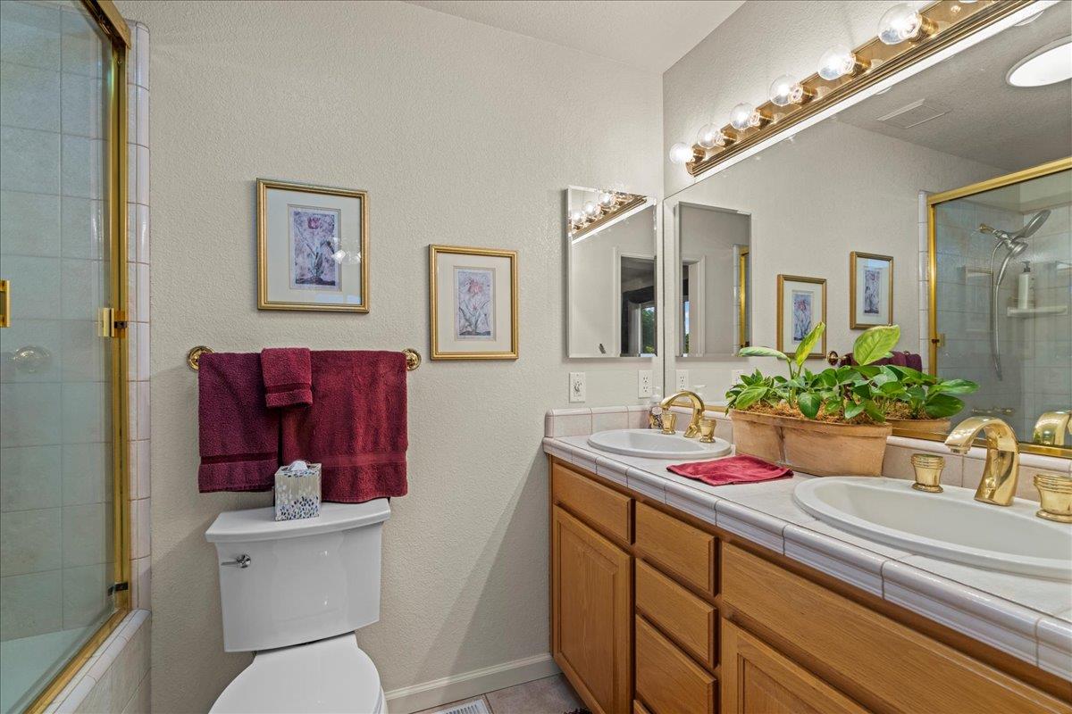 6980 Timeview Way Prunedale, CA 93907 - Photo 20 of 47 a bathroom with a sink mirror vanity and toilet