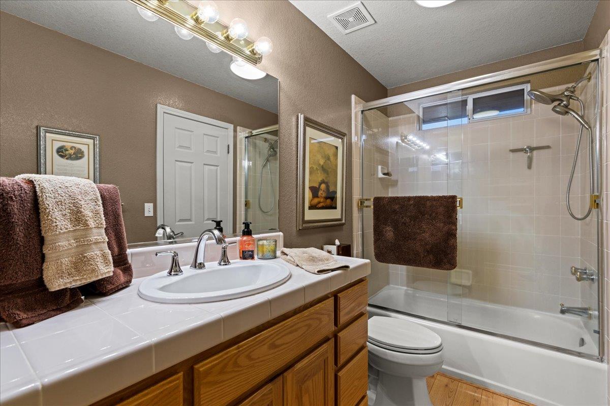 6980 Timeview Way Prunedale, CA 93907 - Photo 24 of 47 a bathroom with a sink double vanity granite tub and shower