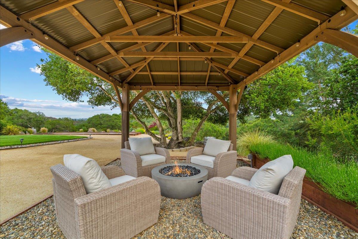 6980 Timeview Way Prunedale, CA 93907 - Photo 29 of 47 a view of a patio with couches chairs and a table and chairs
