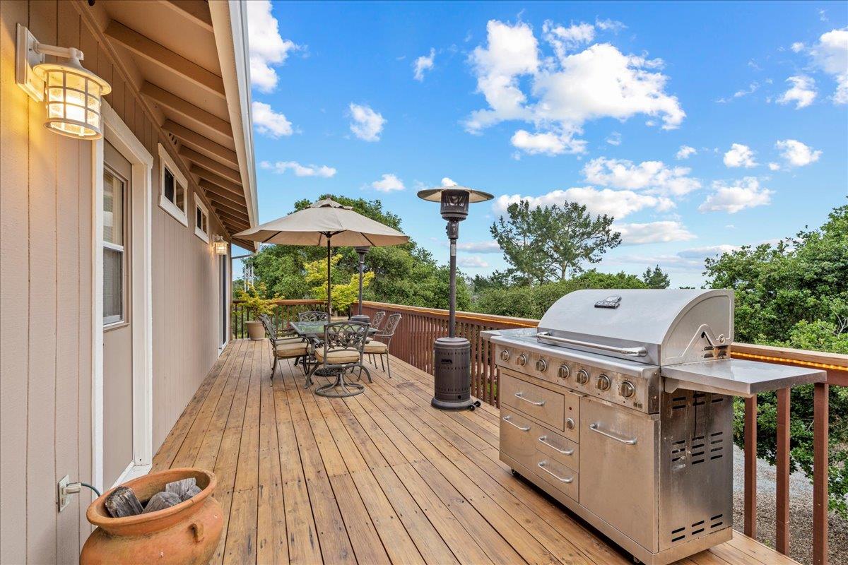 6980 Timeview Way Prunedale, CA 93907 - Photo 33 of 47 a view of a patio with table and chairs and wooden floor