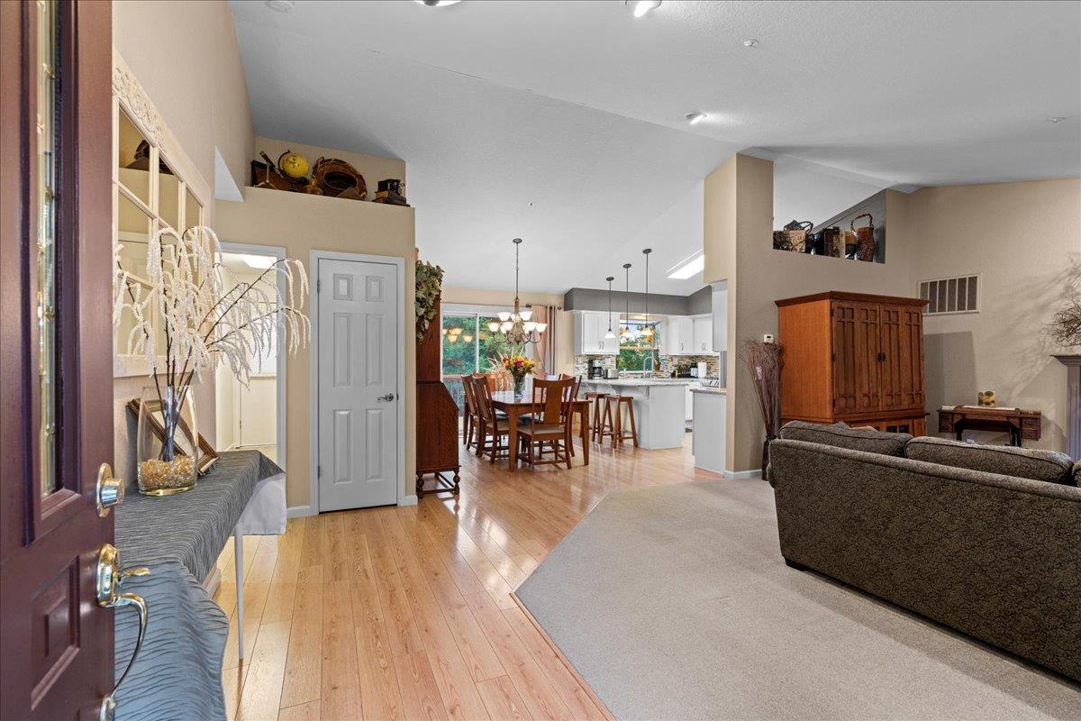 6980 Timeview Way Prunedale, CA 93907 - Photo 5 of 47 a living room with furniture a dining table and chairs with kitchen view