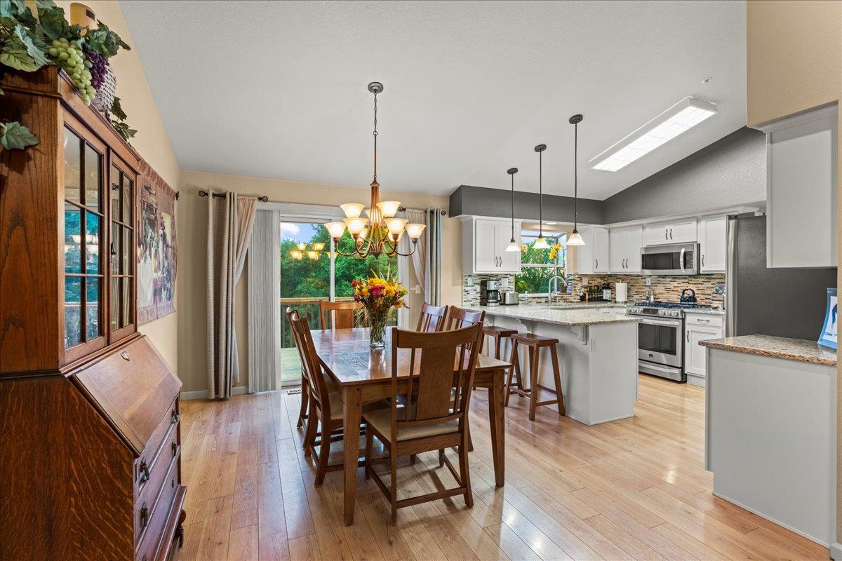 6980 Timeview Way Prunedale, CA 93907 - Photo 8 of 47 a kitchen with stainless steel appliances a dining table chairs stove top oven and sink
