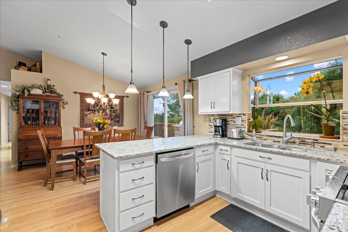 6980 Timeview Way Prunedale, CA 93907 - Photo 10 of 47 a kitchen with a sink stove and wooden cabinets