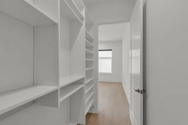 a view of an empty walk in closet