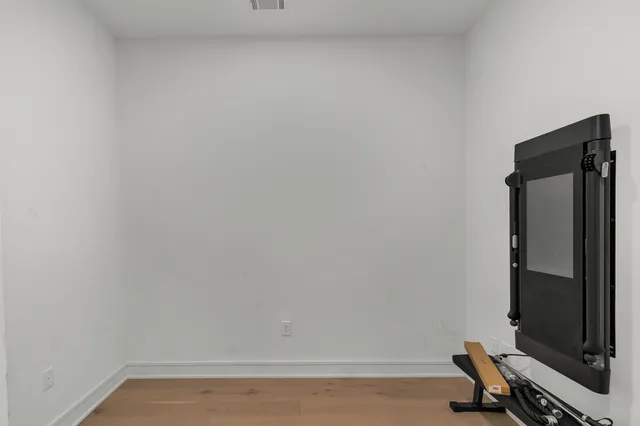 a room with window and wooden floor