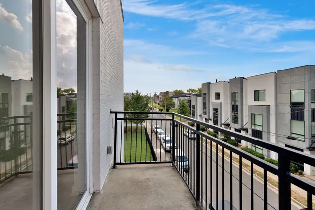 a view of a large building with a small yard