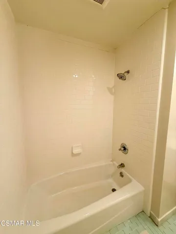 a patio with table and chairs