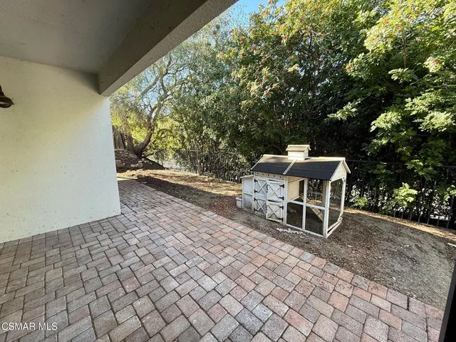 a bench is sitting in middle of a yard