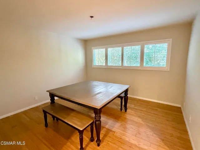 a room with a table and a window