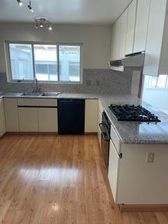 869 Crestview Drive Millbrae, CA 94030 - Photo 4 of 14 a kitchen with granite countertop a stove and a sink