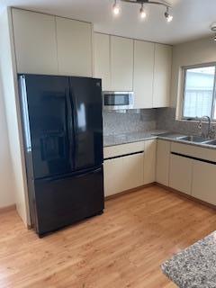 869 Crestview Drive Millbrae, CA 94030 - Photo 5 of 14 a kitchen with stainless steel appliances granite countertop a refrigerator and a sink