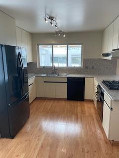 869 Crestview Drive Millbrae, CA 94030 - Photo 7 of 14 a large kitchen with wooden floor and stainless steel appliances