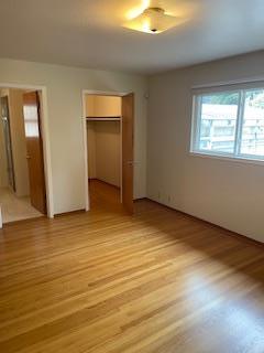 869 Crestview Drive Millbrae, CA 94030 - Photo 10 of 14 a view of an empty room with wooden floor and a window