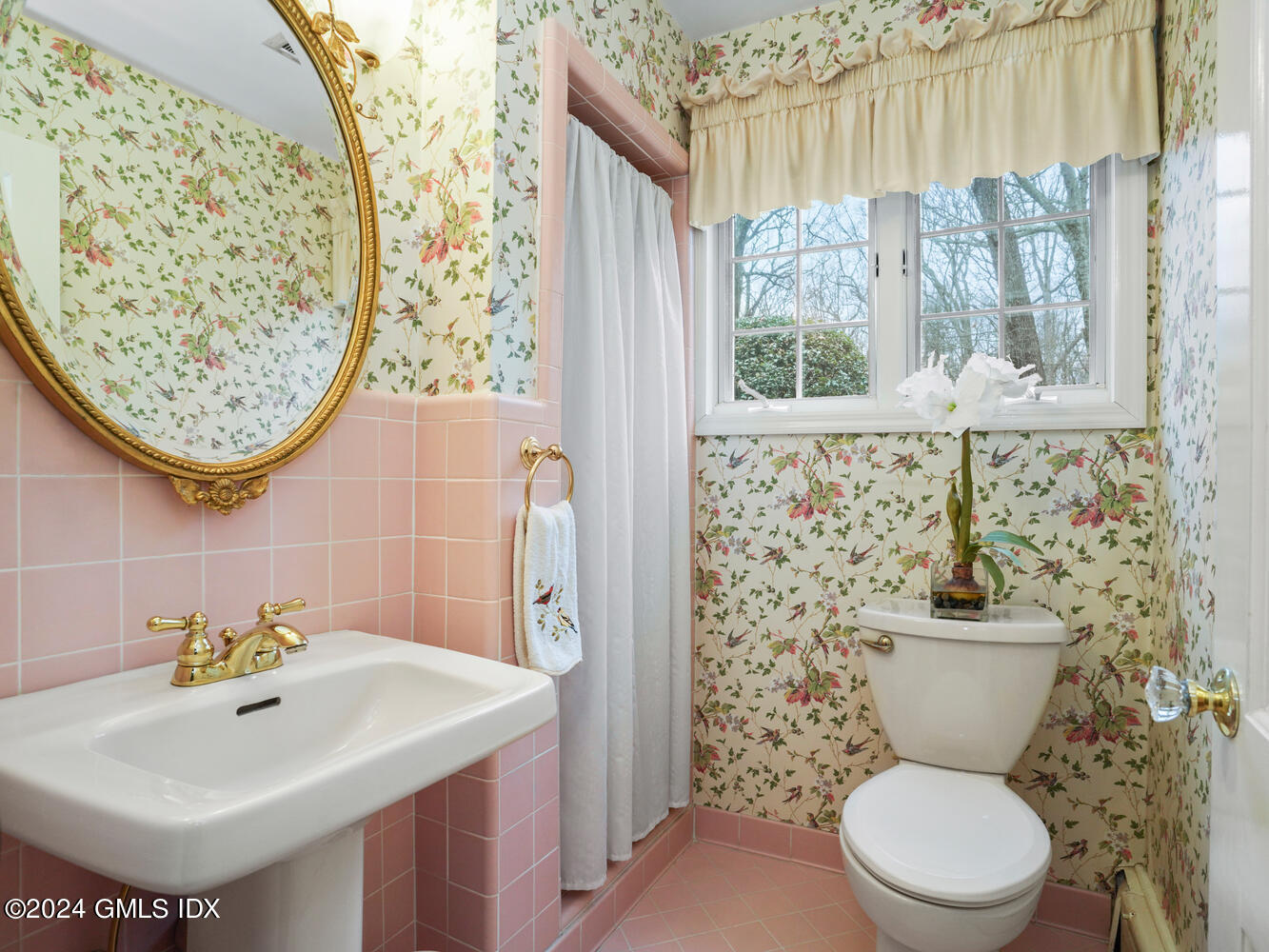 191 Cat Rock Road Cos Cob, CT 06807 - Photo 13 of 30 a bathroom with a toilet sink and mirror