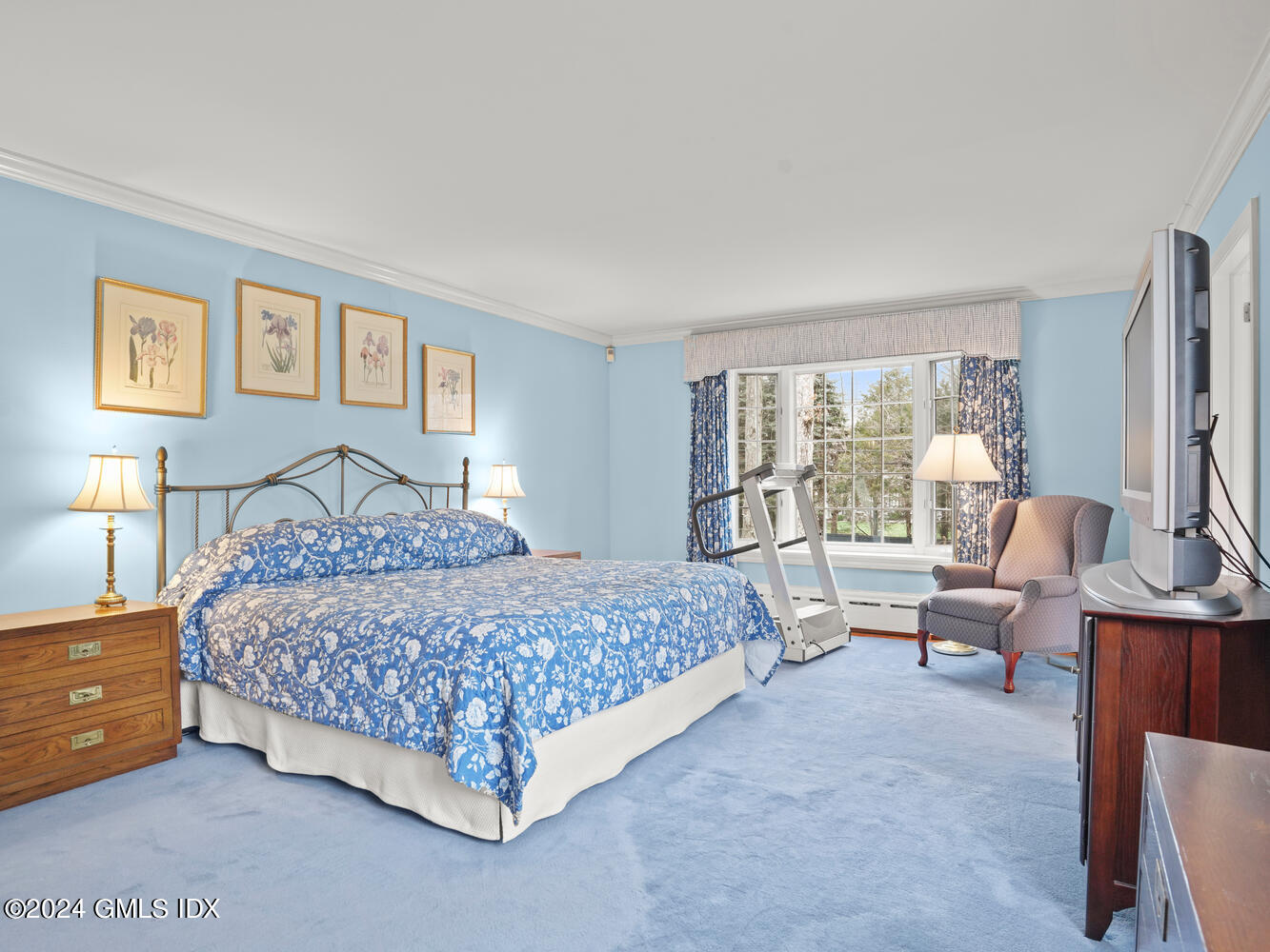 191 Cat Rock Road Cos Cob, CT 06807 - Photo 16 of 30 a bedroom with a bed and glass walk in closet