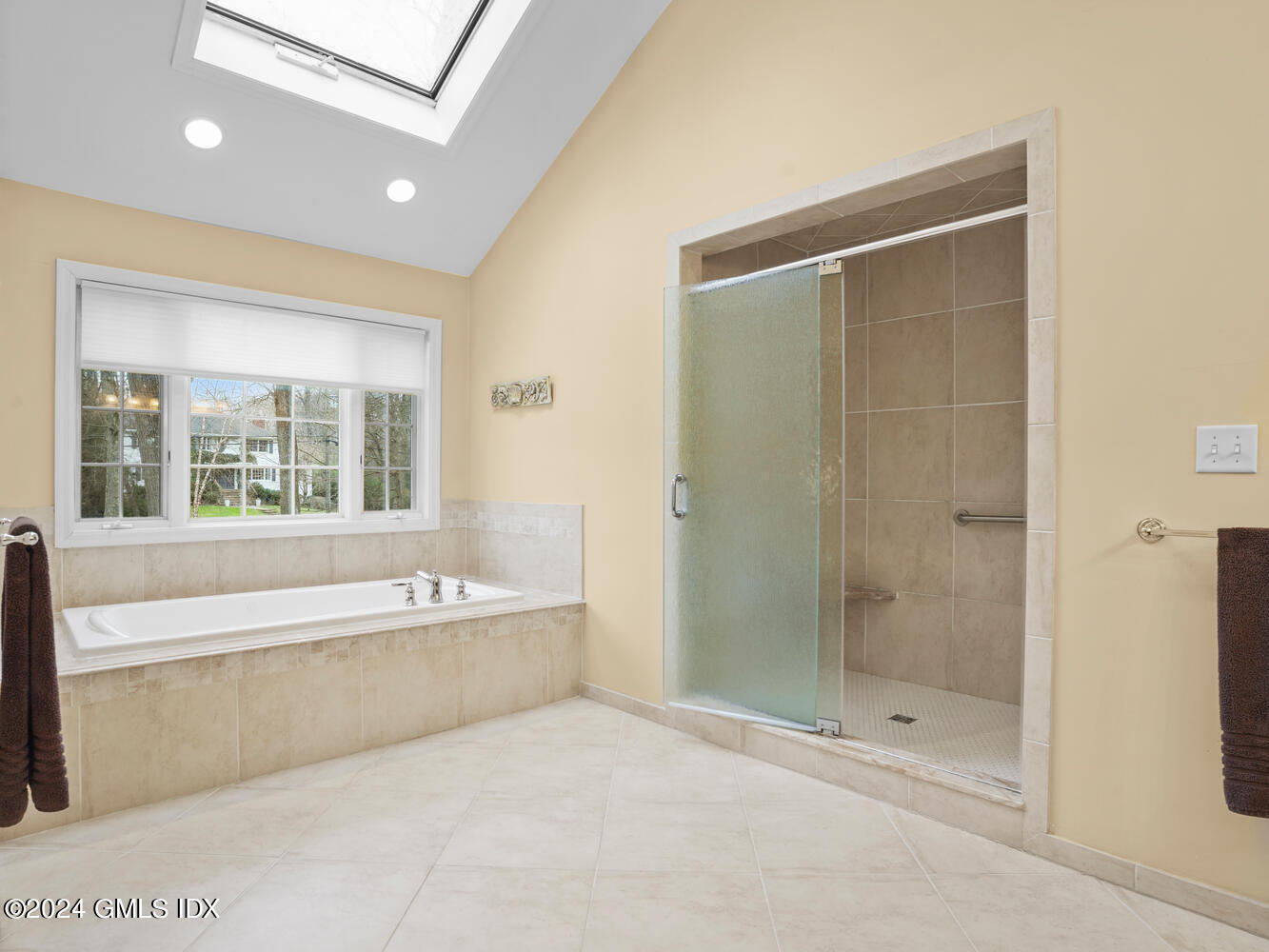 191 Cat Rock Road Cos Cob, CT 06807 - Photo 18 of 30 a spacious bathroom with a bathtub and shower