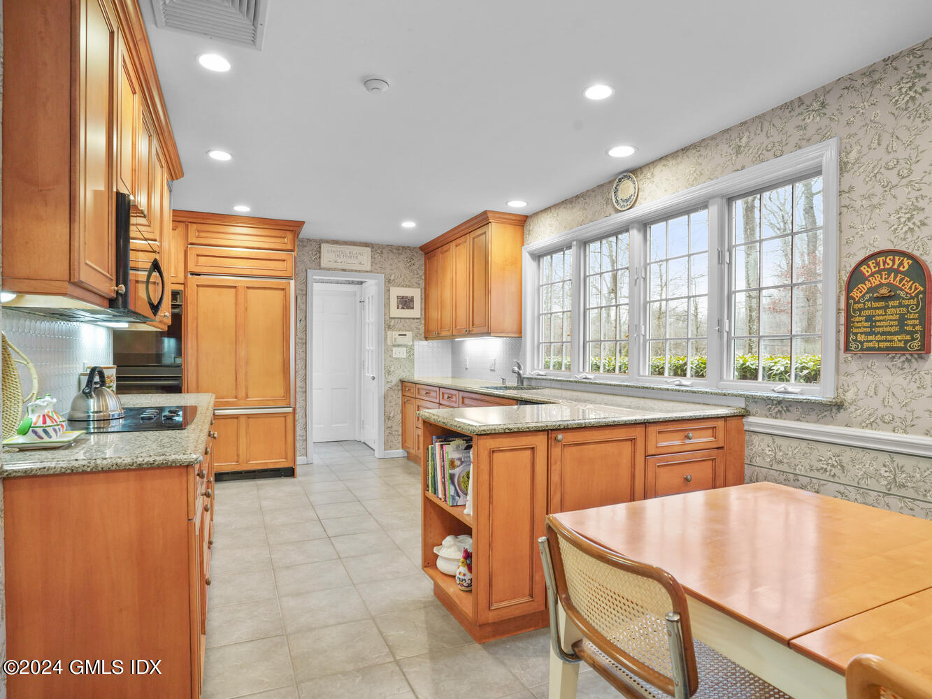 191 Cat Rock Road Cos Cob, CT 06807 - Photo 20 of 30 a kitchen with stainless steel appliances granite countertop a sink stove and refrigerator