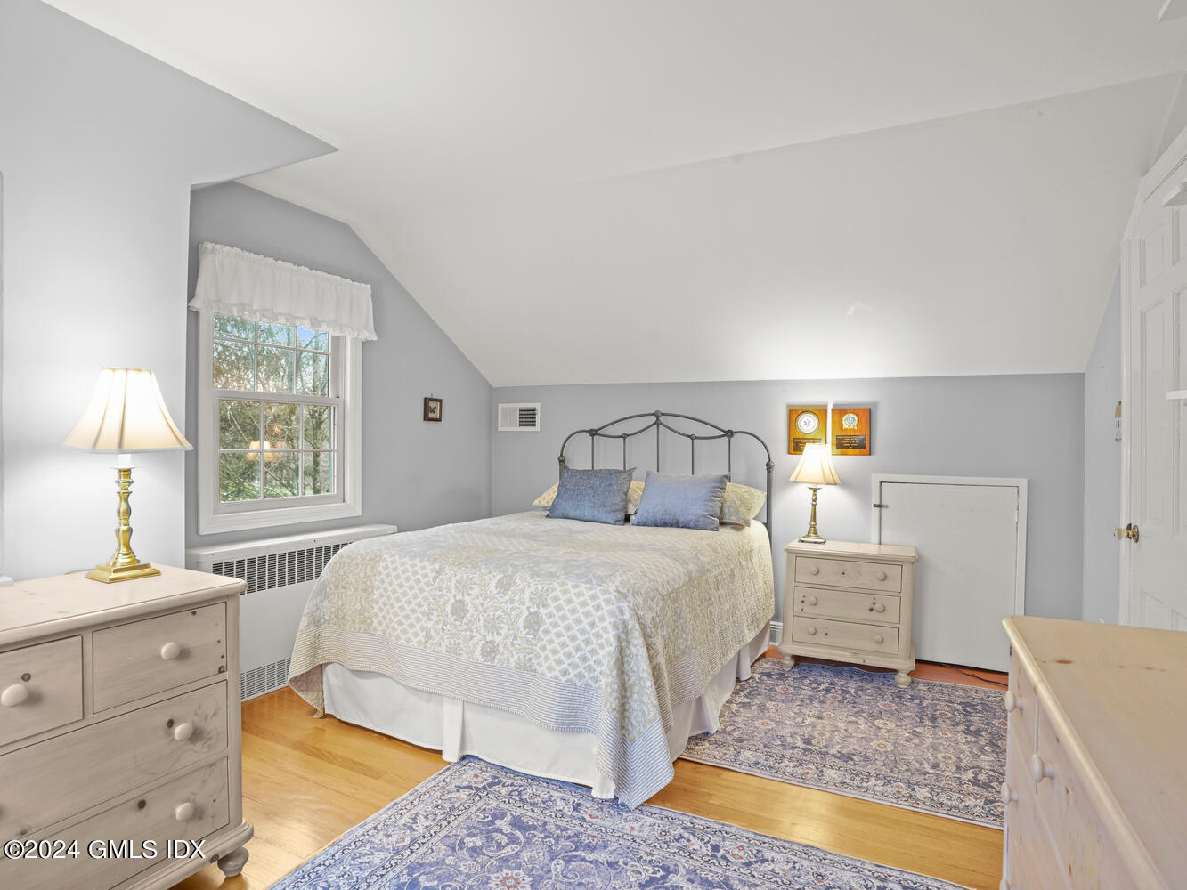 191 Cat Rock Road Cos Cob, CT 06807 - Photo 23 of 30 a bedroom with a bed and window