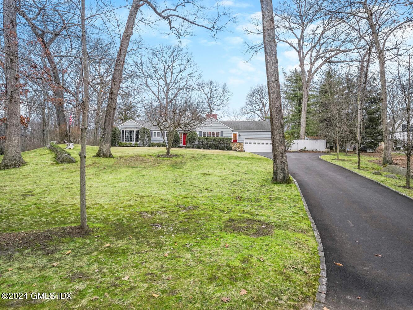 191 Cat Rock Road Cos Cob, CT 06807 - Photo 24 of 30 a view of a yard with a house