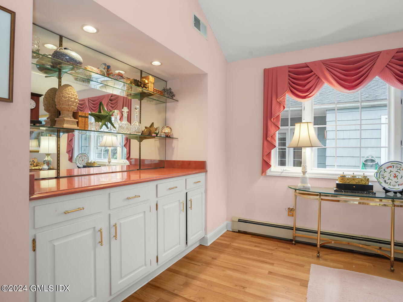 191 Cat Rock Road Cos Cob, CT 06807 - Photo 5 of 30 a bathroom with a sink and a mirror