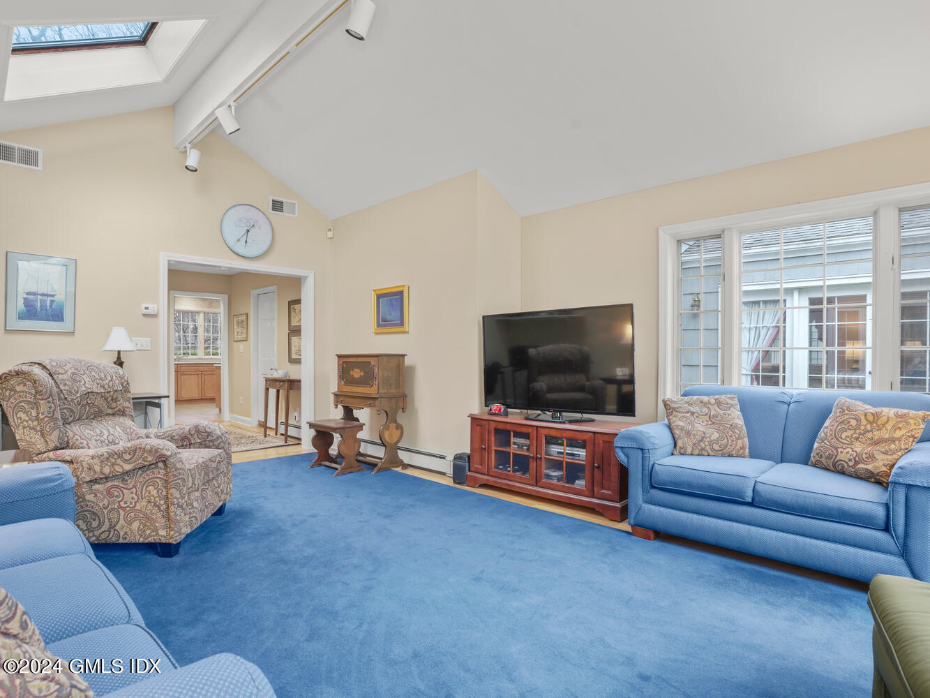 191 Cat Rock Road Cos Cob, CT 06807 - Photo 10 of 30 a living room with furniture and a flat screen tv