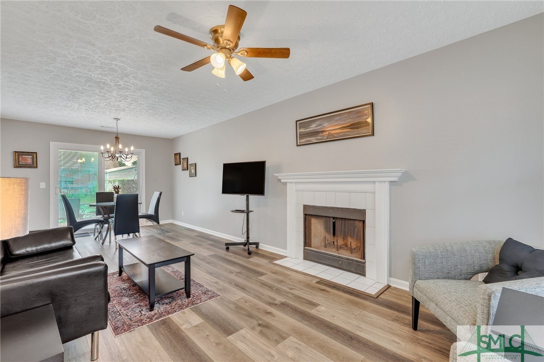 11 Ropemaker Court, Unit FURNISHED Savannah, GA 31410 - Photo 4 of 40 Wood Burning Fireplace & Two Chairs