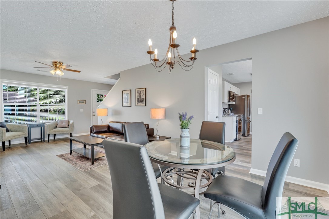 11 Ropemaker Court, Unit FURNISHED Savannah, GA 31410 - Photo 6 of 40 Dining Area Open to Living Room