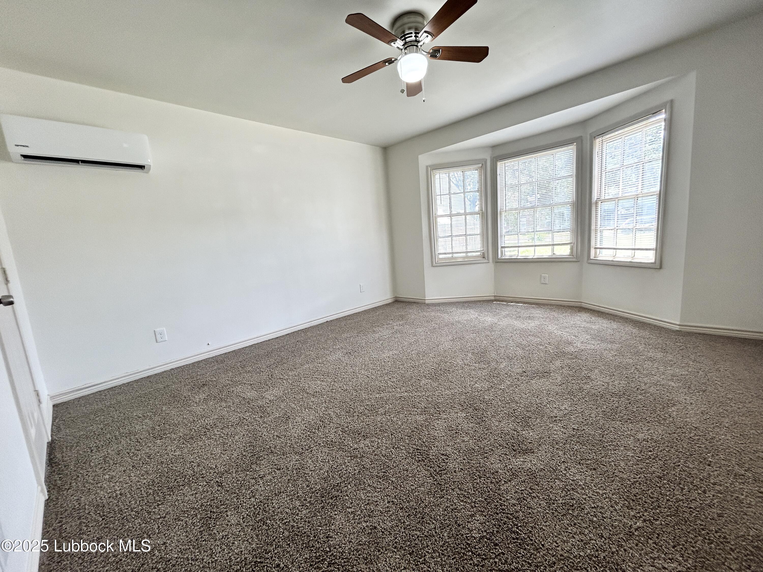 1912 21st Street Lubbock, TX 79411 - Photo 4 of 9 a view of an empty room with a window