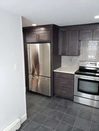 a kitchen with appliances and cabinets