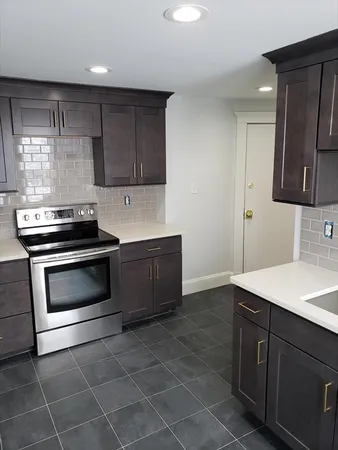 a kitchen with a stove and a sink