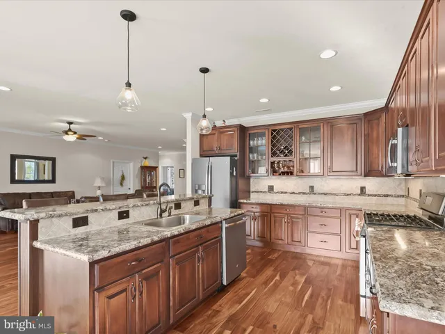 a large kitchen with lots of counter space sink and appliances