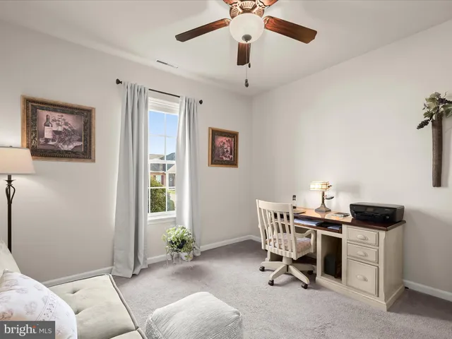 a work room with furniture and windows