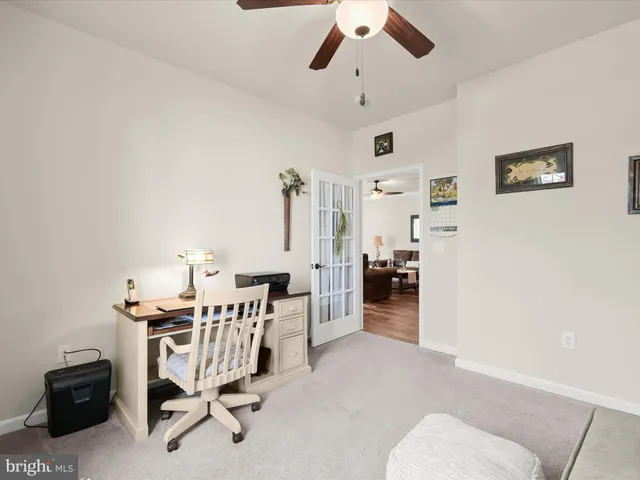 a view of a workspace with furniture and a livingroom
