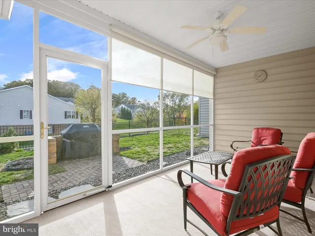 a roof deck with table and chairs