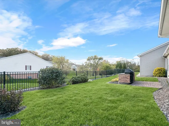 a view of a backyard with sitting area