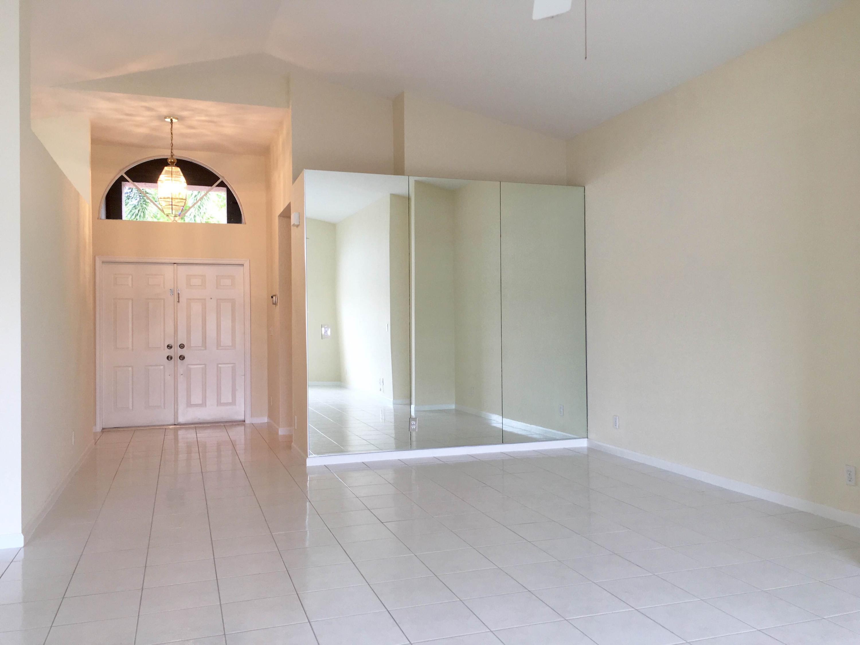 1340 Sabal Lakes Road Delray Beach, FL 33445 - Photo 8 of 19 Dining Room and Front Doors